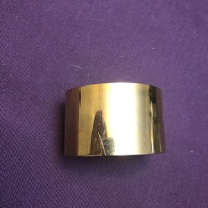 Steel Time Gold Colored Cuff Bracelet. Does bend some to give a better fit.